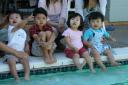 four kids at the pool
