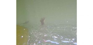 underwater shot of peytons hand